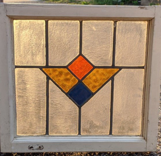 MULTI COLORED GEOMETRIC STAINED GLASS WINDOW