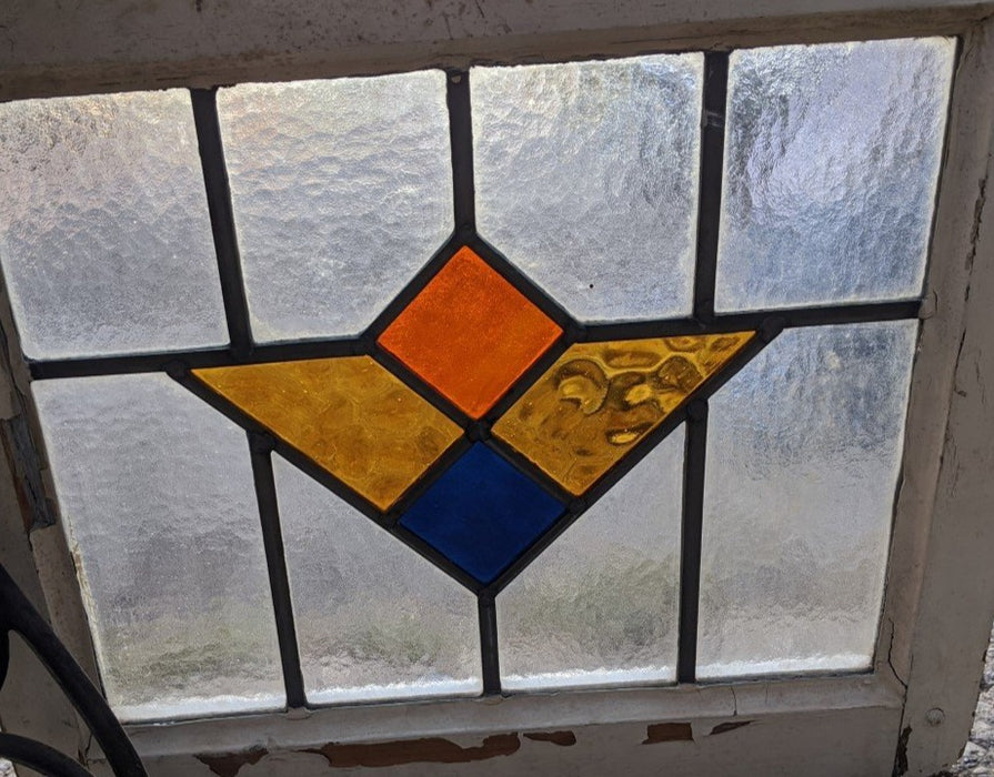 MULTI COLORED GEOMETRIC STAINED GLASS WINDOW