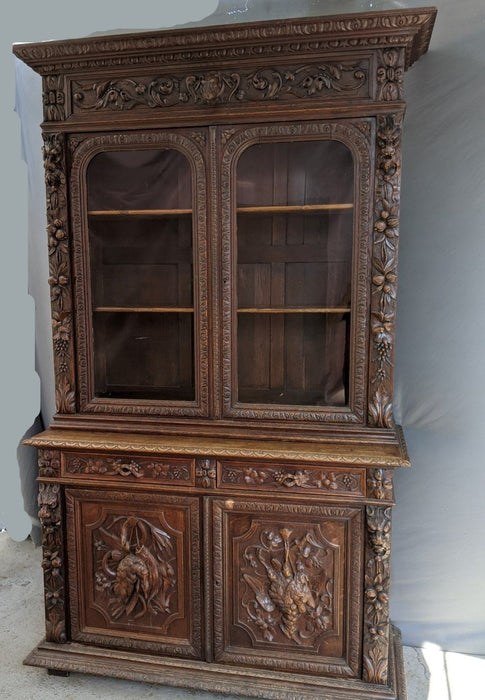GAME CARVED OAK BOOKCASE WITH DOGHEAD