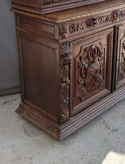 GAME CARVED OAK BOOKCASE WITH DOGHEAD