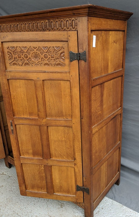 SMALL LIGHT OAK 2 DOOR CABINET W/ FLORETTES