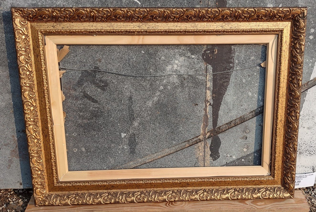 MEDIUM ORNATE GILT FRAME WITH CARVED FILLET
