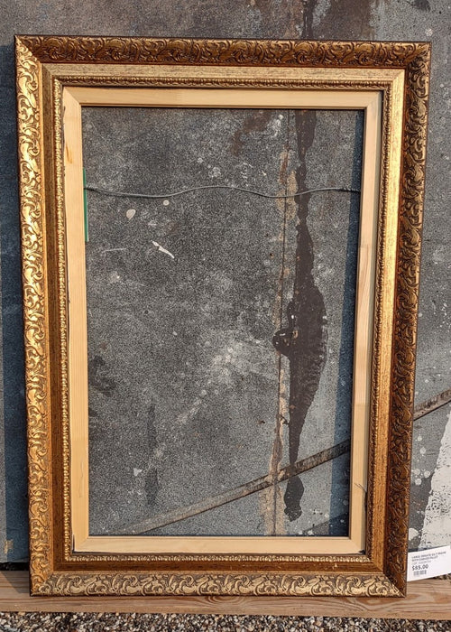 LARGE ORNATE GILT FRAME WITH CARVED FILLET