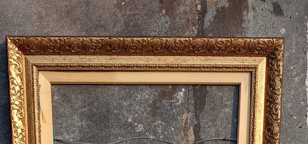 LARGE ORNATE GILT FRAME WITH CARVED FILLET