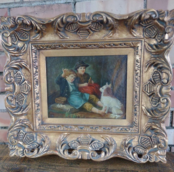GOLD FRAMED OIL PAINTING OF BOYS AND DOG