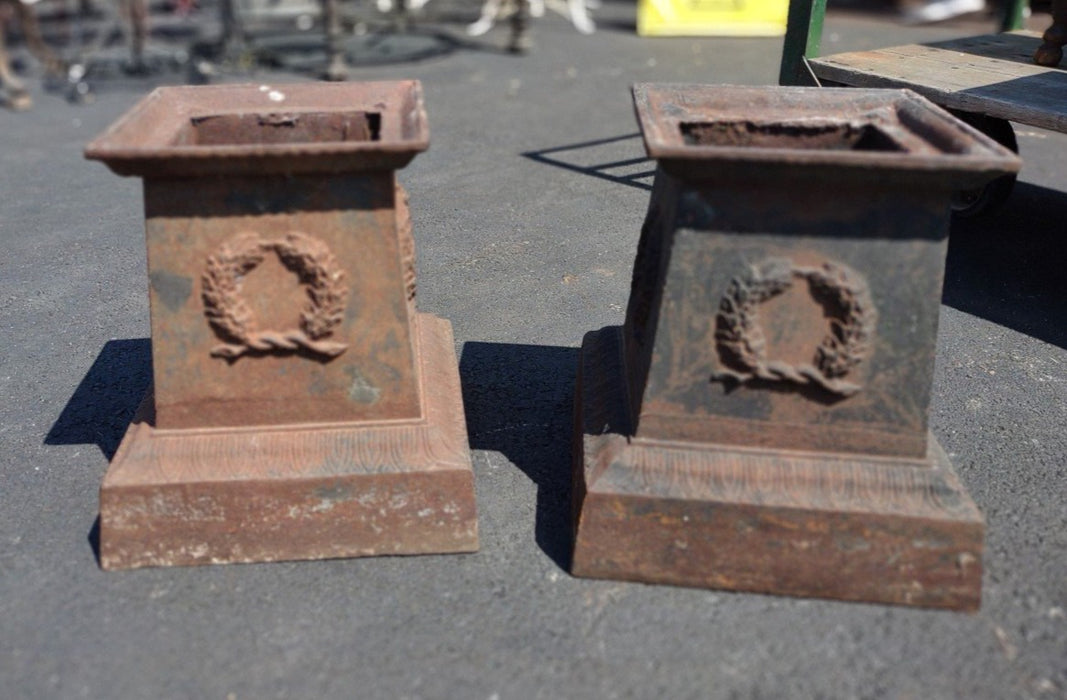 PAIR OF OLD IRON GARDEN URN BASES