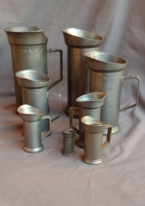 SET OF FRENCH GRADUATED TANKARD MEASURES