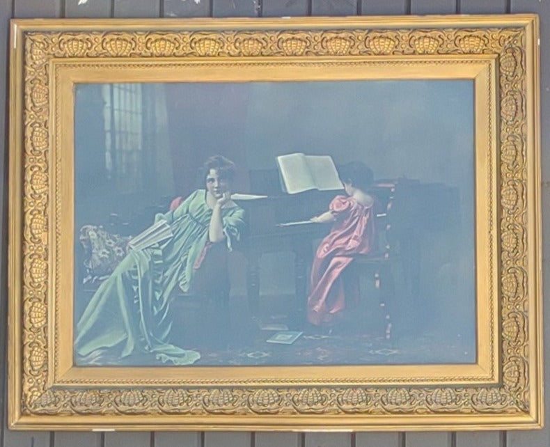 LARGE GOLD FRAMED PRINT OF WOMAN AND CHILD BY A PIANO