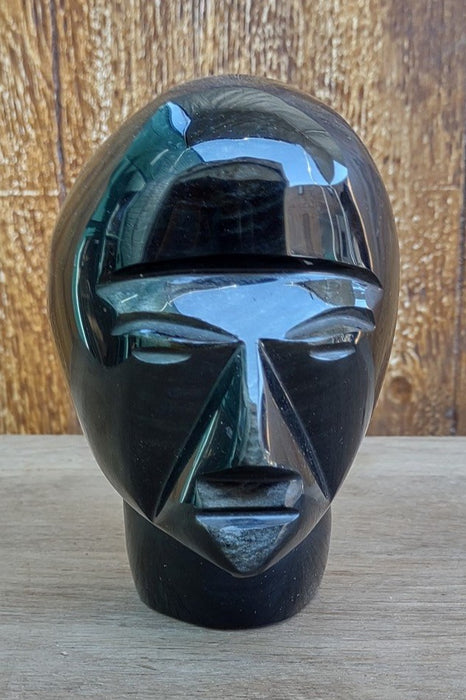 SMALL GLASS HEAD STATUE