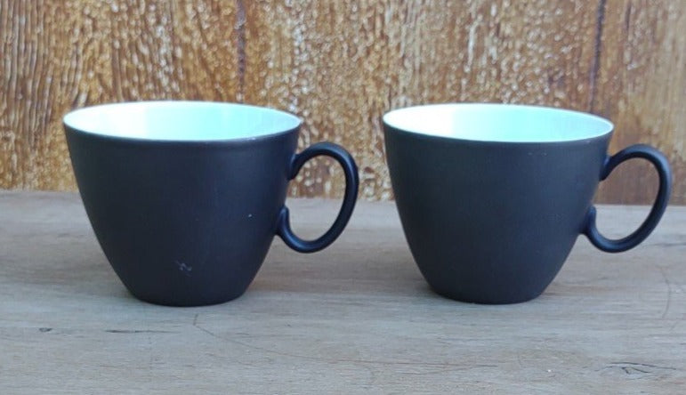 PAIR OF BLACK AND WHITE CUPS