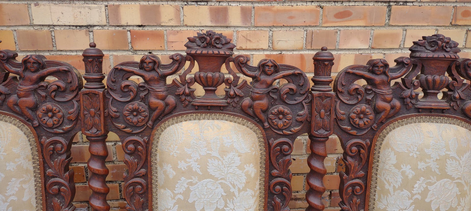 LOUIS XIII BARLEY TWIST SETTEE WITH CHERUBS