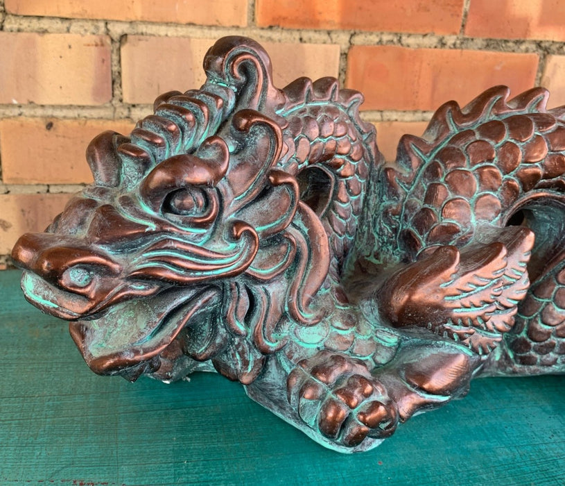 PLASTER BROWN AND GREEN PAINTED DRAGON STATUE