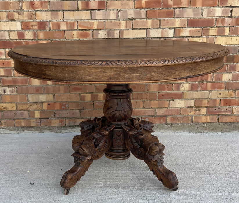 FRENCH OAK PEDESTAL TABLE WITH GRIFFINS