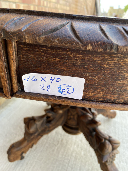 FRENCH OAK PEDESTAL TABLE WITH GRIFFINS