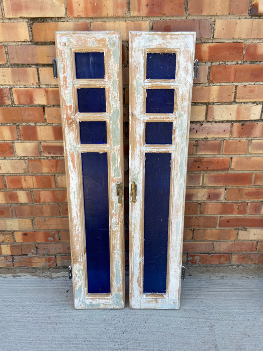 PAIR OF WHITE WINDOWS WITH BLUE GLASS