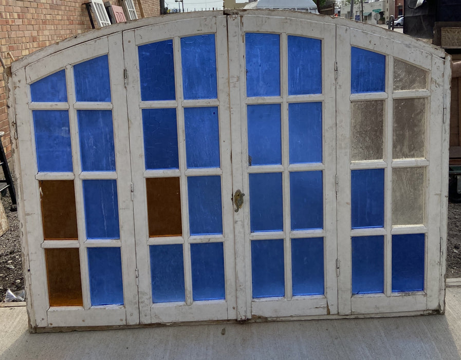 LARGE PRIMITIVE ARCHED WOODEN FRAMED MULTICOLORED WINDOW