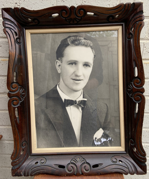 WOOD FRAME WITH PHOTO OF YOUNG MAN