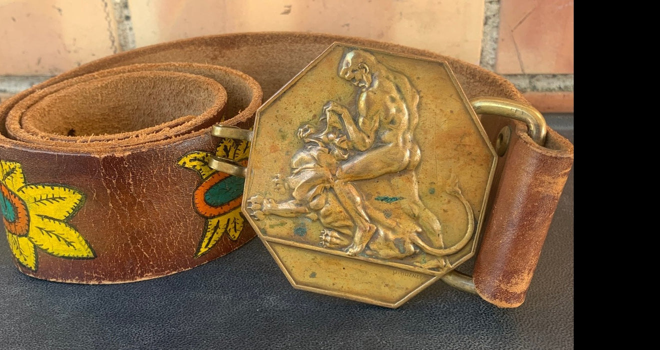 BRONZE MAN WITH LION BUCKLE ON BELT