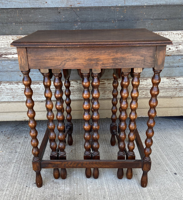 KNOB TURNED DROP LEAF NEST OF TABLES