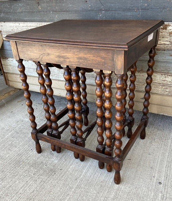 KNOB TURNED DROP LEAF NEST OF TABLES