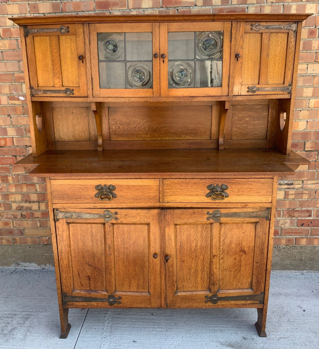 ARTS AND CRAFTS OAK SIDEBOARD WITH BLOWN GLASS