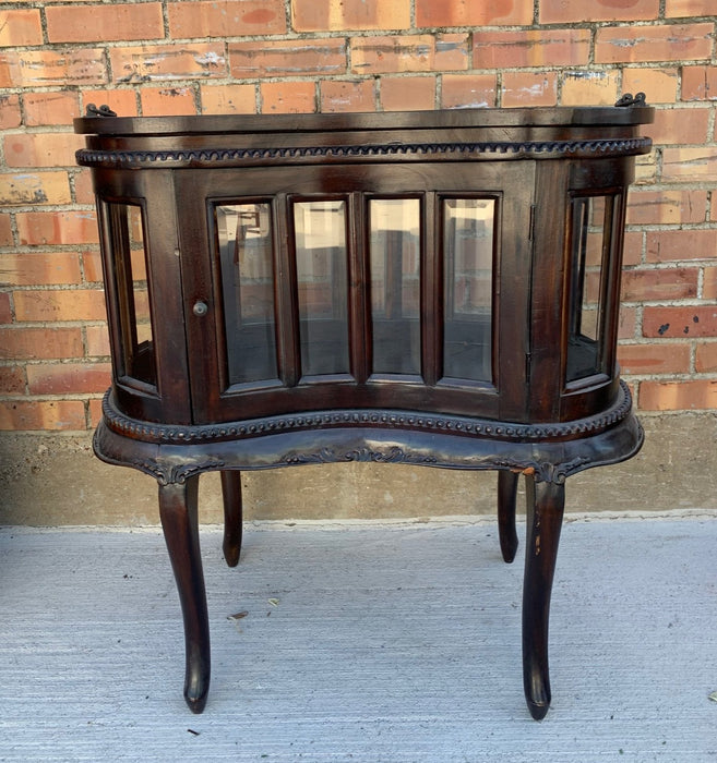 CHOCOLATE KIDNEY SHAPED CABINET WITH BEVELED GLASS AND REMOVABLE TRAY