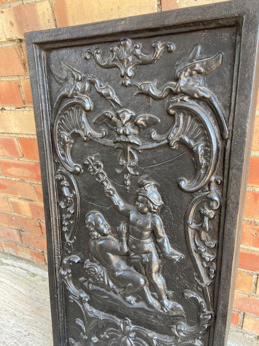 LARGE BLACK IRON FIRE FRONT WITH PUTTI