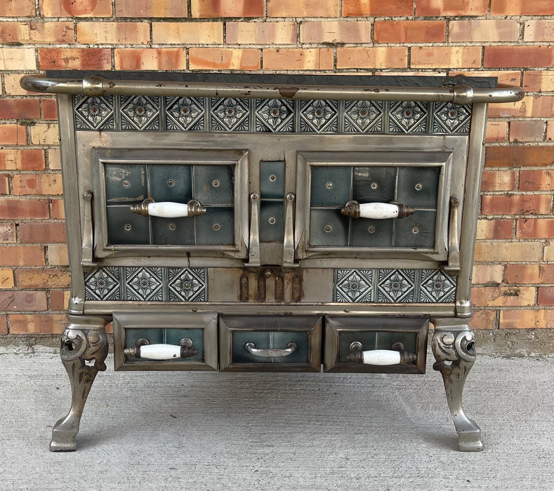 ANTIQUE DECORATIVE STOVE W/ TILE FRONT AND PORCELAIN HANDLES