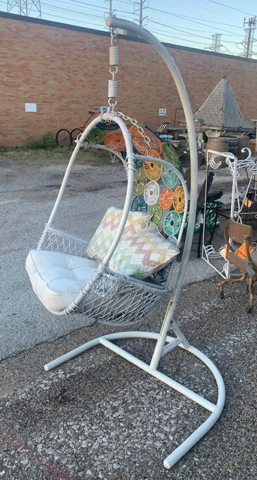 70'S STYLE BOUNCY CHAIR WITH COLORFUL WICKER ROSETTES - AS FOUND