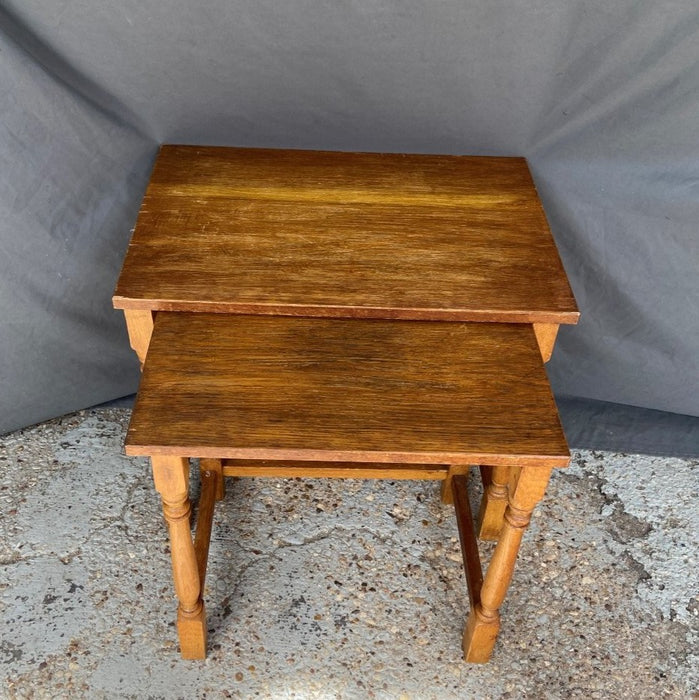 PAIR OF BLOCK AND TURNED OAK NESTING TABLES