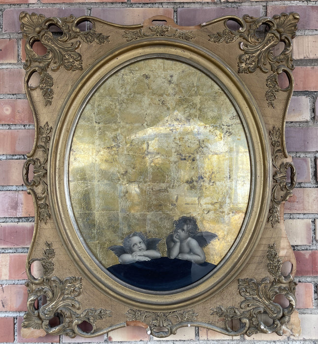 WOOD AND GESSO OVAL FRAMED MIRROR WITH PUTTI