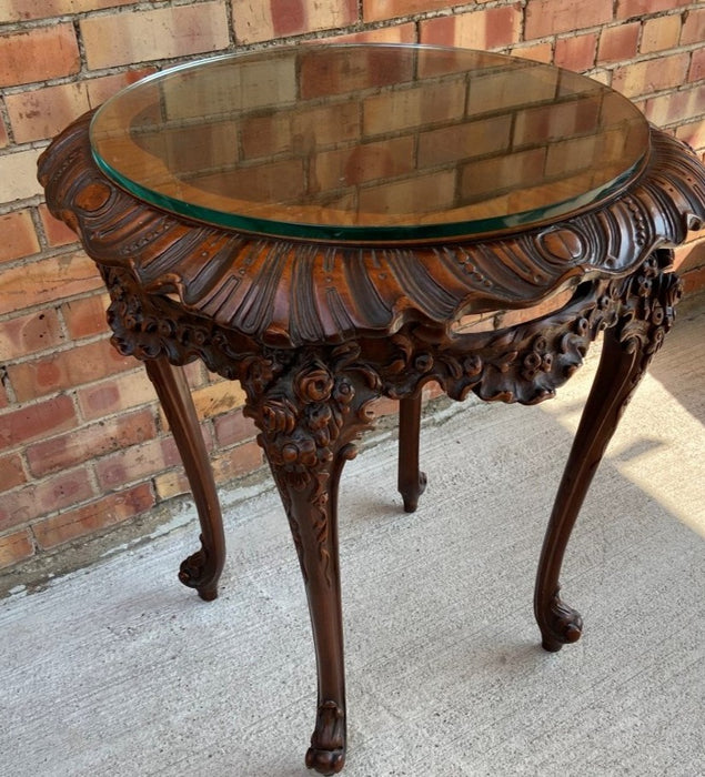 1930'S LARGE ORNATELY CARVED CROSS BANDED TABLE