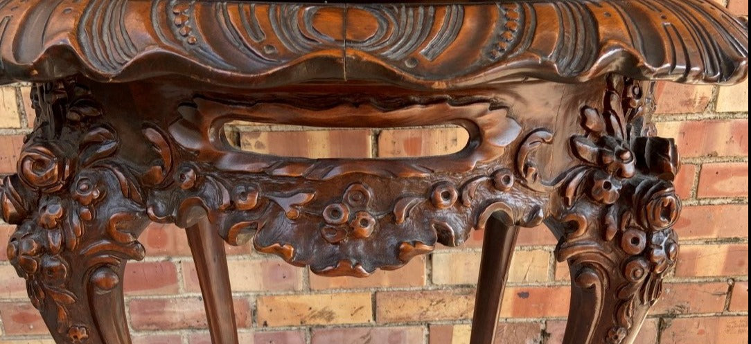 1930'S LARGE ORNATELY CARVED CROSS BANDED TABLE