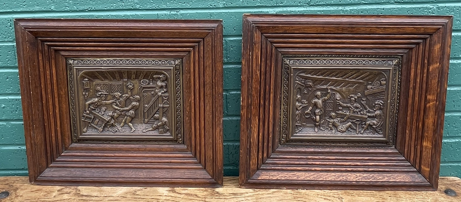 PAIR OF FRENCH BRASS AND OAK RELIEF TAVERN SCENE PICTURES