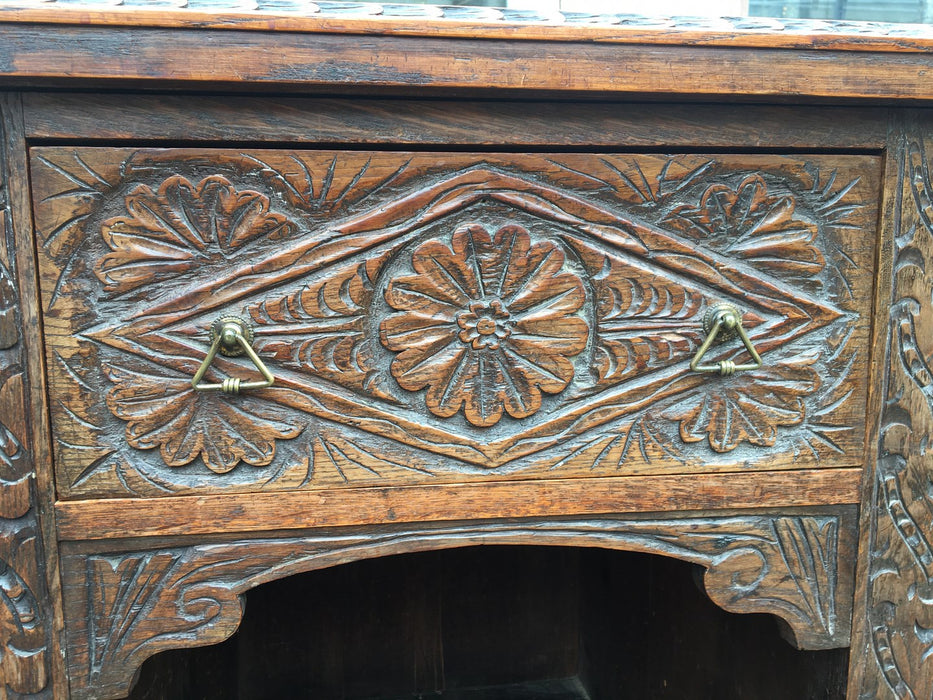 LOW CHIP CARVED ENGLISH OAK SIDEBOARD WITH FRET CARVED TOP