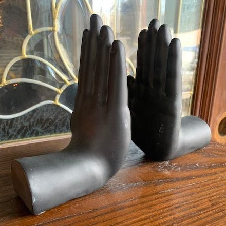 PAIR OF BLACK HAND BOOKENDS