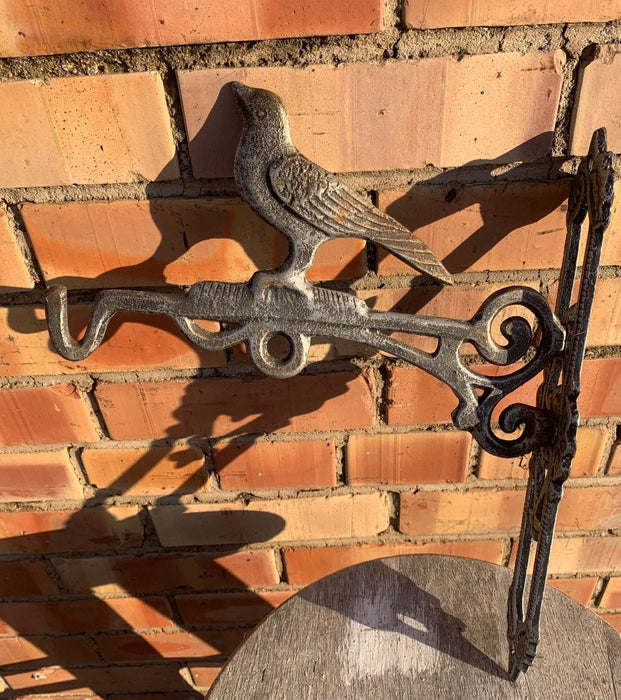 CAST METAL PLANT HOLDER WITH BIRD