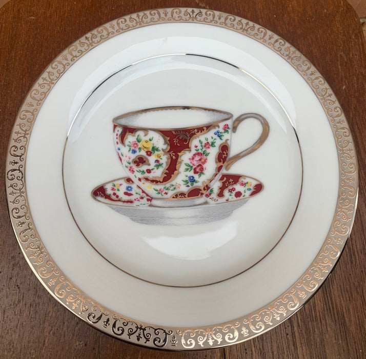 DECORATIVE PLATE WITH RED CUP AND SAUCER DESIGN