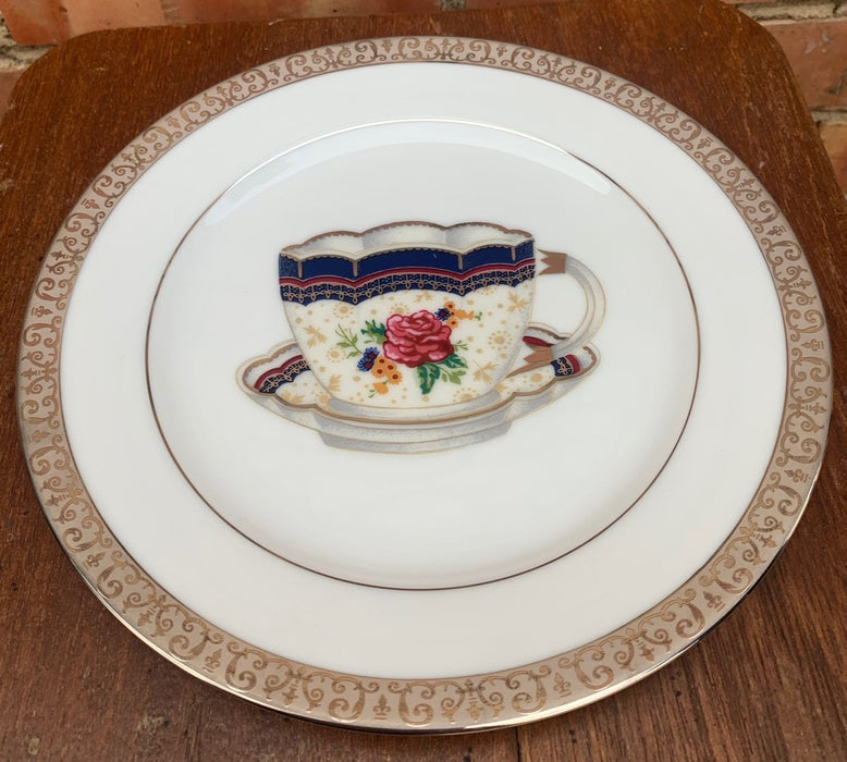 DECORATIVE PLATE WITH BLUE CUP AND SAUCER DESIGN