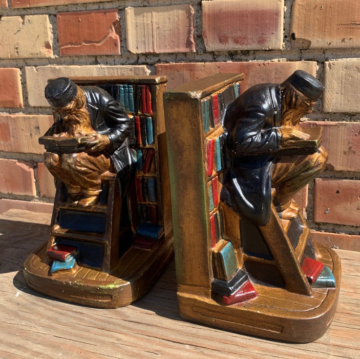 1920'S PAIR OF PLASTER BOOKENDS OF READING SCHOLAR