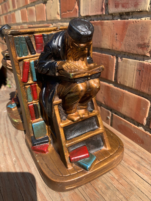 1920'S PAIR OF PLASTER BOOKENDS OF READING SCHOLAR