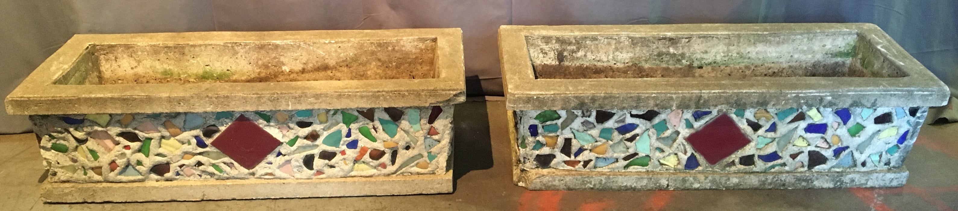 PAIR OF LONG CONCRETE PLANTERS WITH MOSAIC ORNAMENTATION