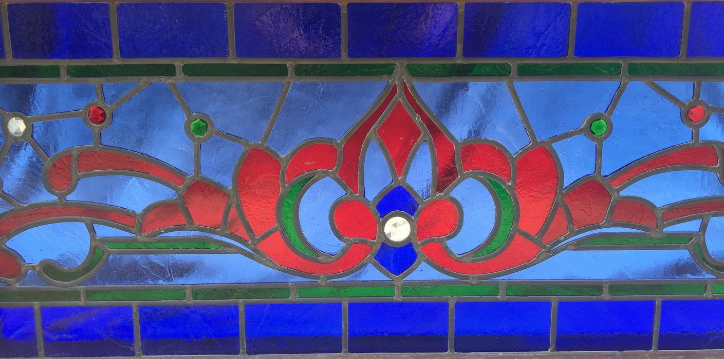 LONG RED AND BLUE STAINED GLASS TRANSOM WINDOW WITH RONDELL