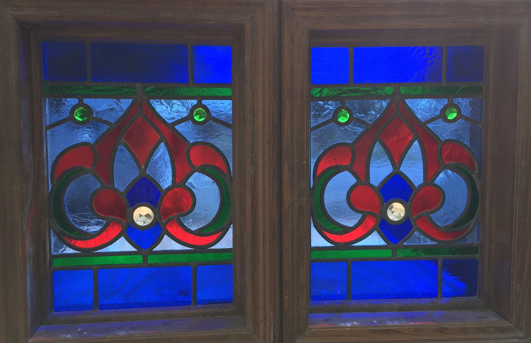 PAIR OF SMALL RED AND BLUE STAINED GLASS WINDOWS WITH RONDELL