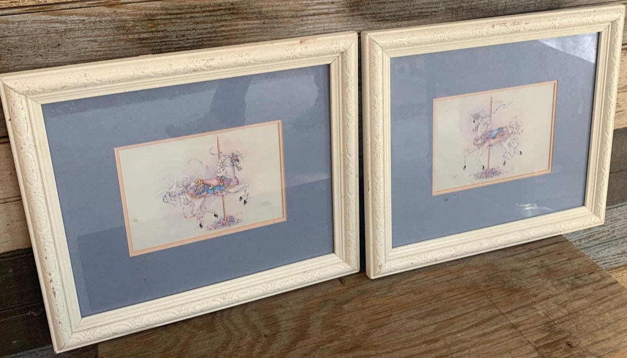 PAIR OF CAROUSEL HOURSE PRINTS IN WHITE FRAMES