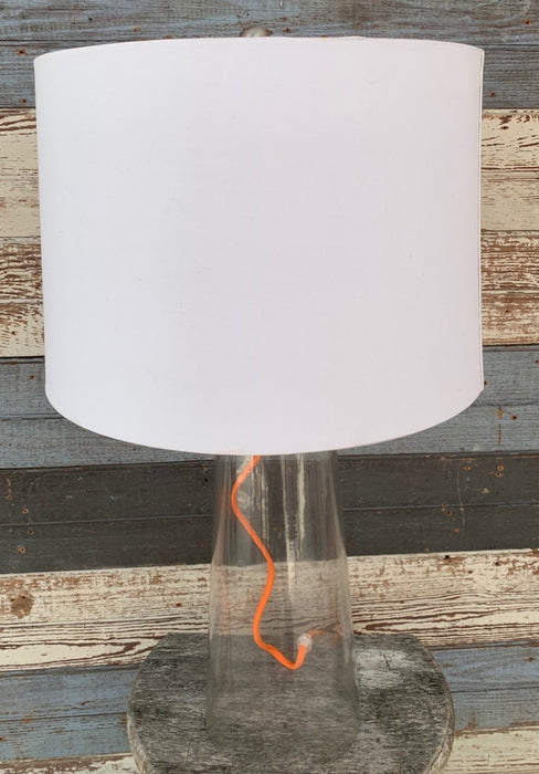 TABLE LAMP WITH CLEAR GLASS BASE AND ORANGE CORD - NOT OLD