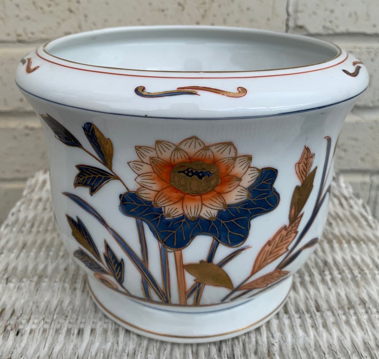 WHITE WITH BLUE AND ORANGE FLORAL DESIGN PLANTER
