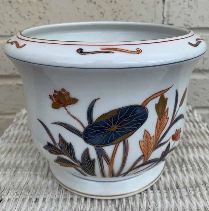 WHITE WITH BLUE AND ORANGE FLORAL DESIGN PLANTER