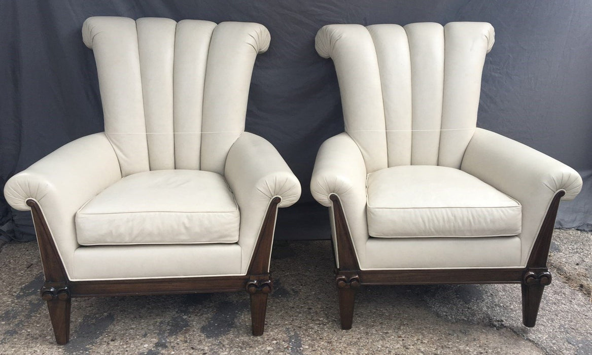 PAIR OF OVERSIZE LEATHER ARM CHAIRS WITH CHANNEL BACKS