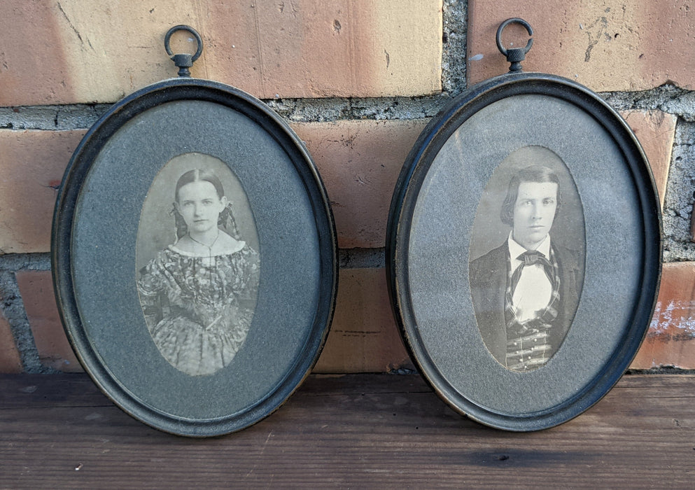 PAIR OF TINY PORTRAITS IN OVAL METAL FRAMES